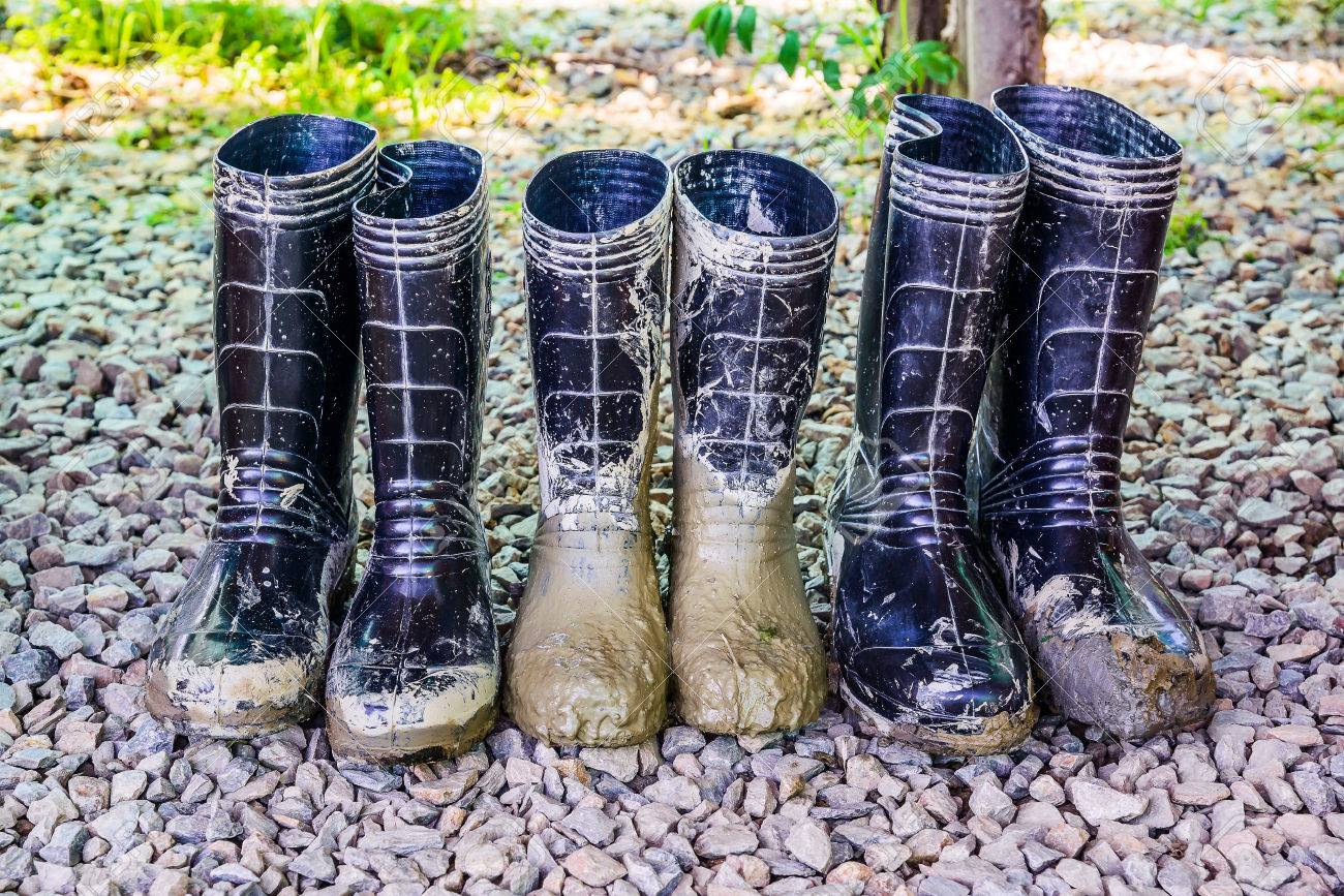 Muddy Rubber Boots On Stone Floor Background Stock Photo Picture And Royalty Free Image Image
