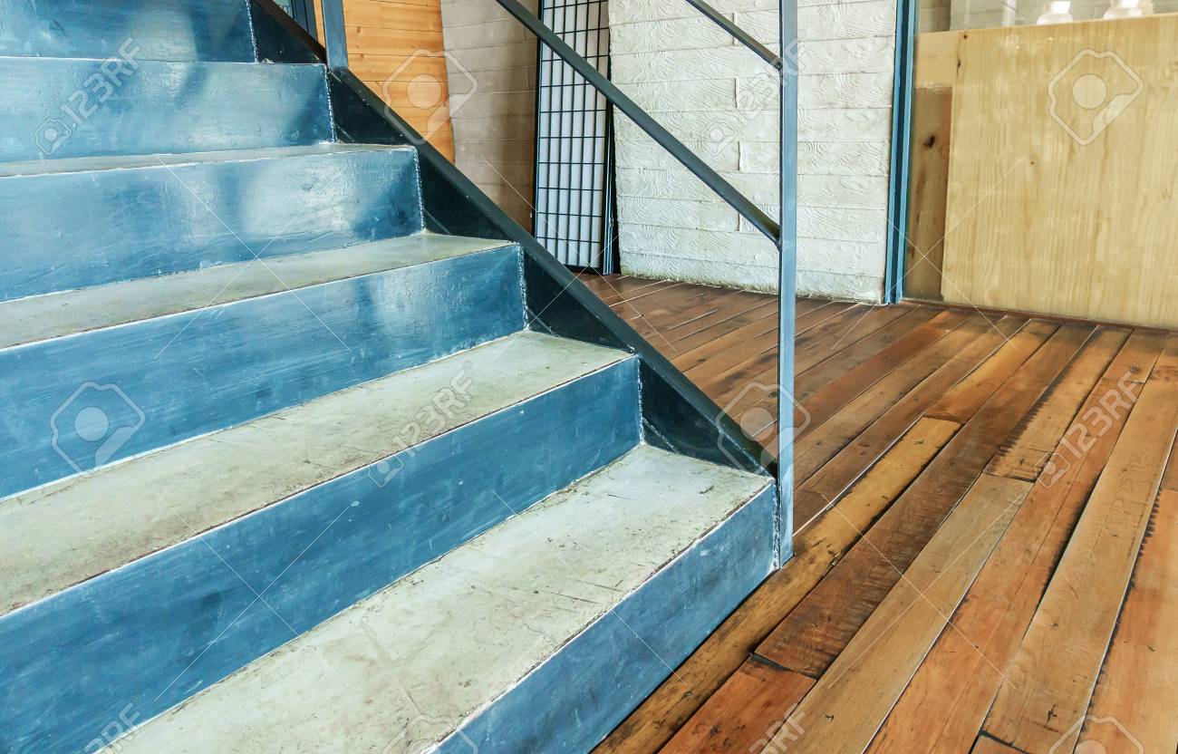Stairway Concrete With Iron And Wooden Floor In A Modern Building