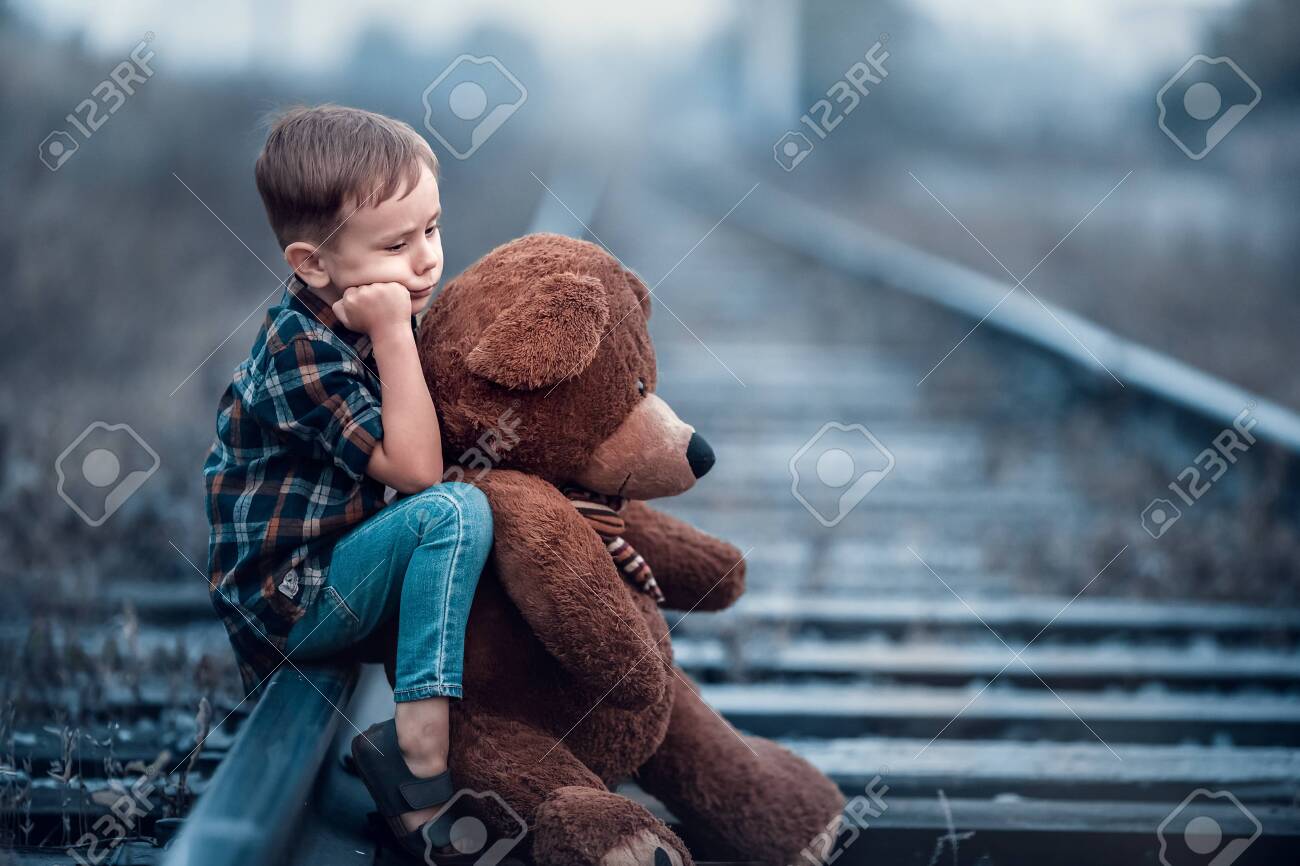 child and teddy bear