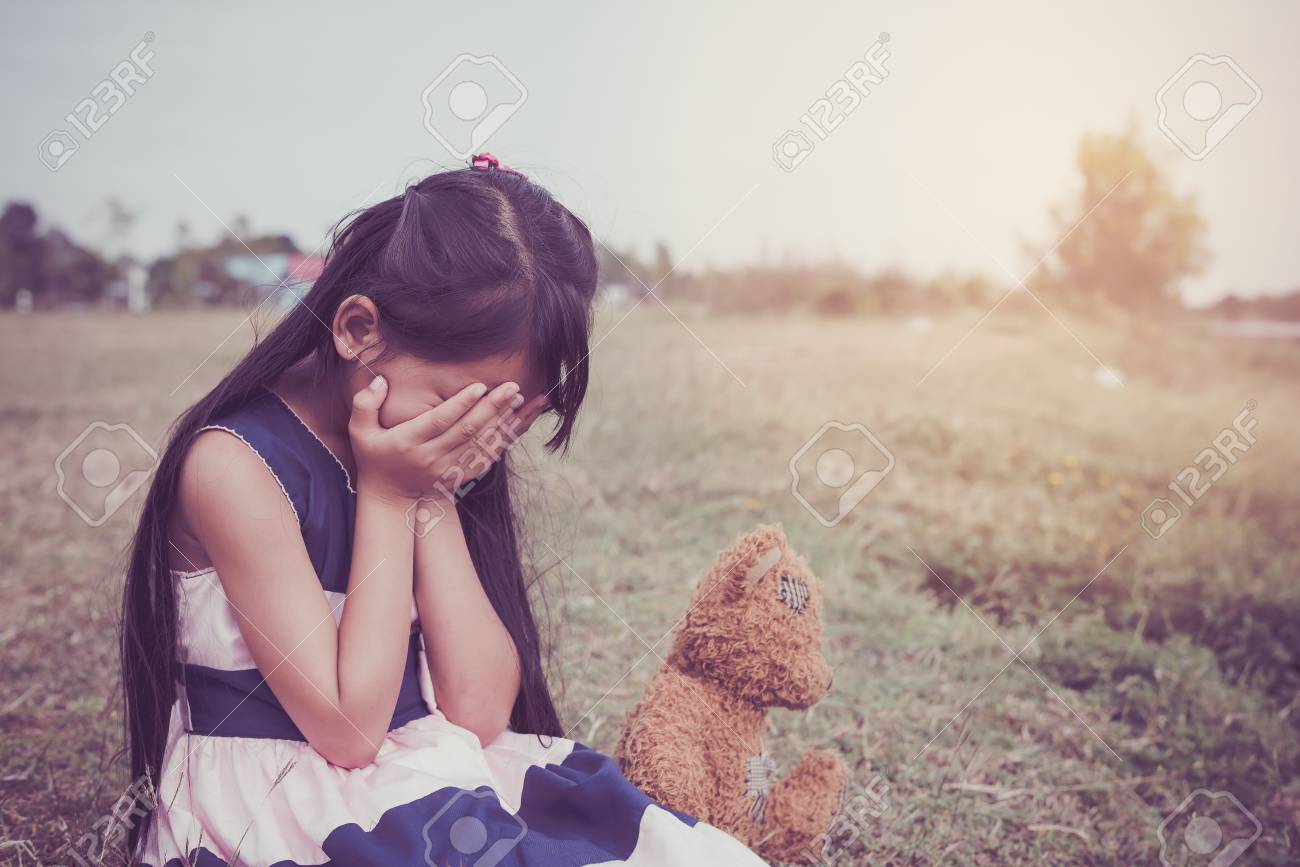 Adorable Sad Girl Sitting Alone With A Teddy Bear, .Upset And ...