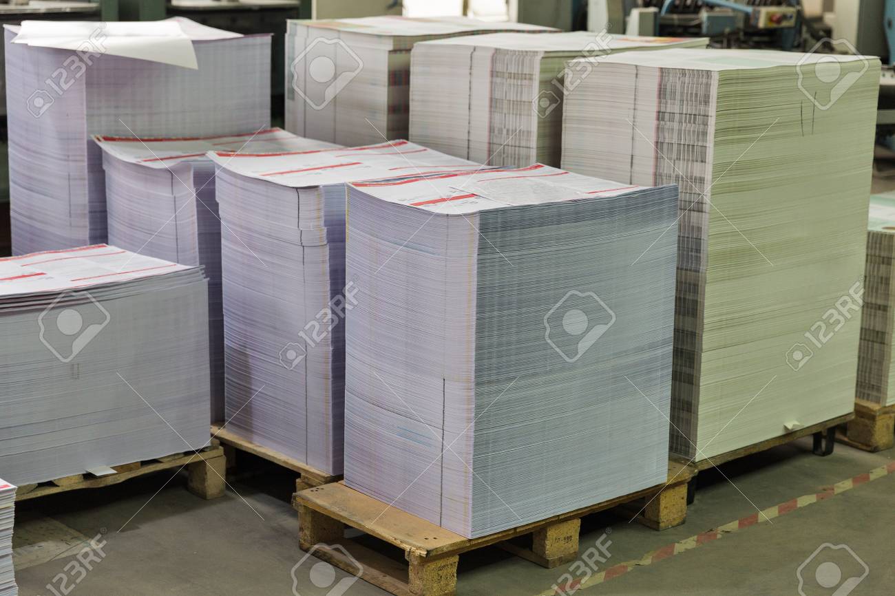 Download Stacks Of Printed Sheets Of Cardboard On Wooden Pallets Closeup Stock Photo Picture And Royalty Free Image Image 118167659