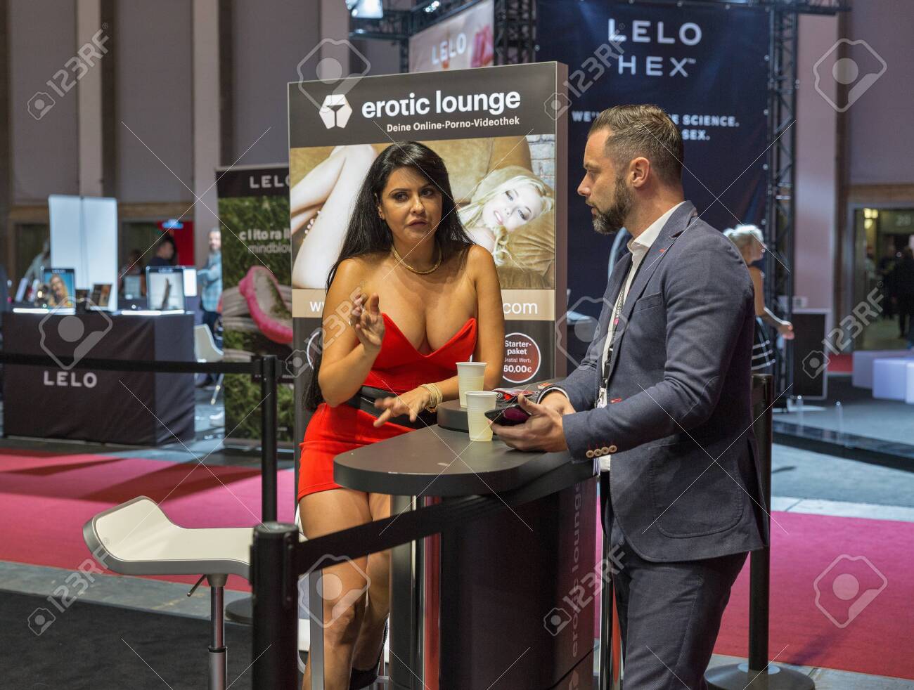 BERLIN, GERMANY - OCTOBER , 2019: People Visit Erotic Lounge Online Porno  Video Library Booth At 23th Venus Trade Fair In Messe Exhibition Hall.  Фотография, картинки, изображения и сток-фотография без роялти. Image  137376098
