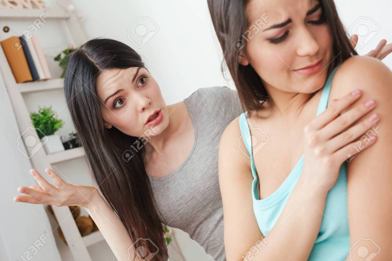 Lesbian Couple In Bedroom At Home