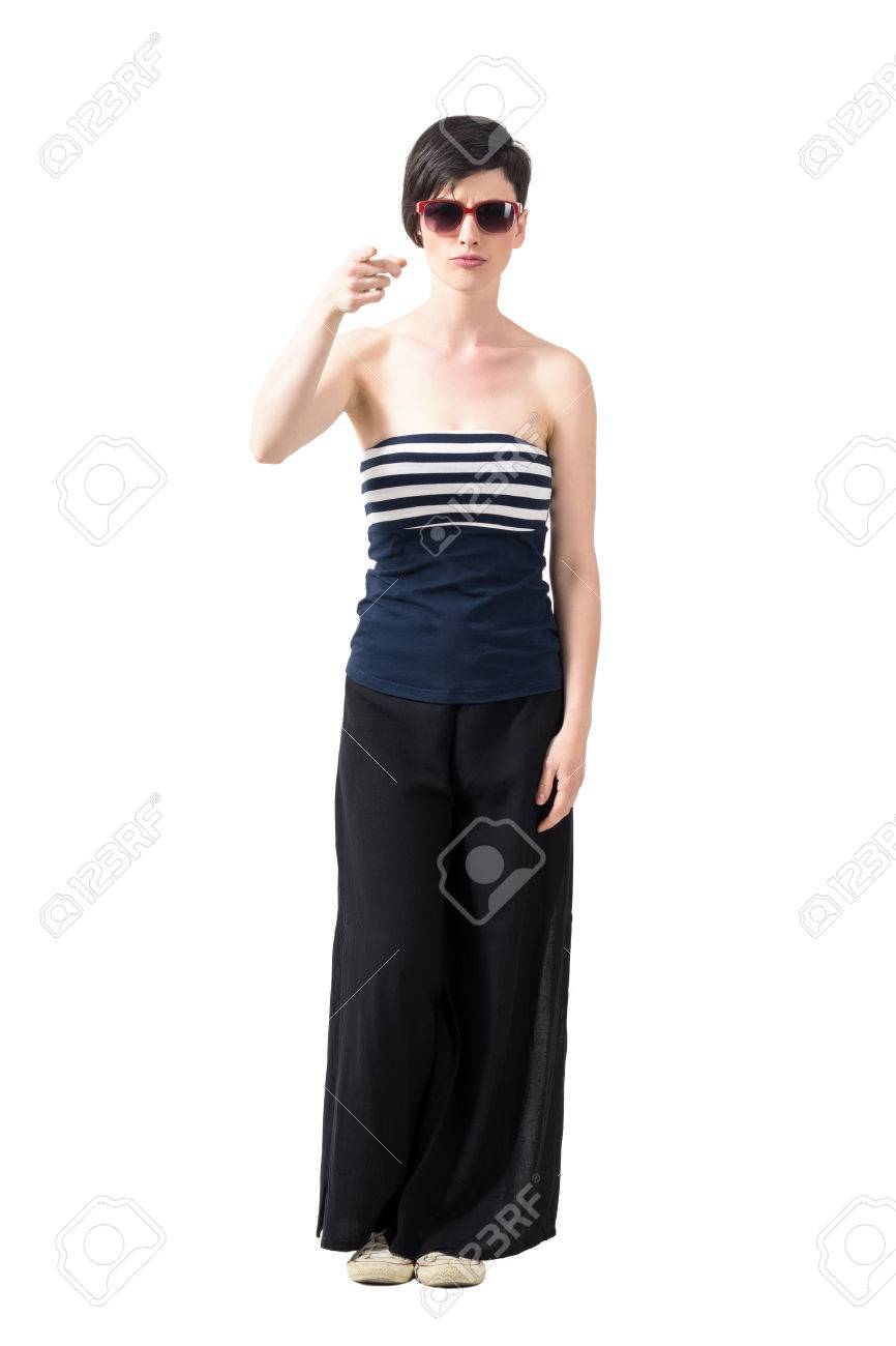 Young Trendy Short Hair Woman Wearing Sunglasses Pointing Finger