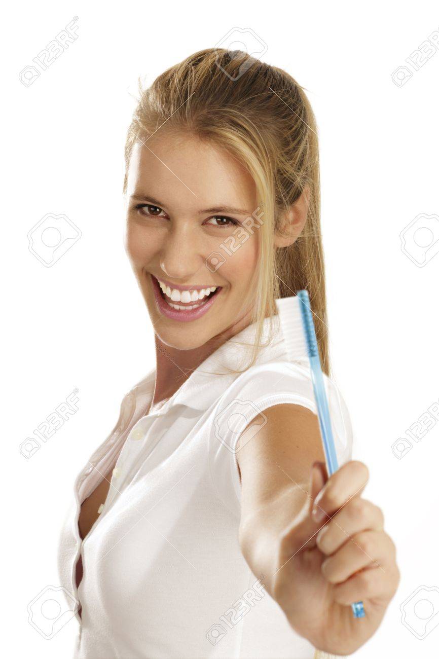 woman showing teeth brush on white background - 15936970 woman showing teeth brush on white background - 15936970