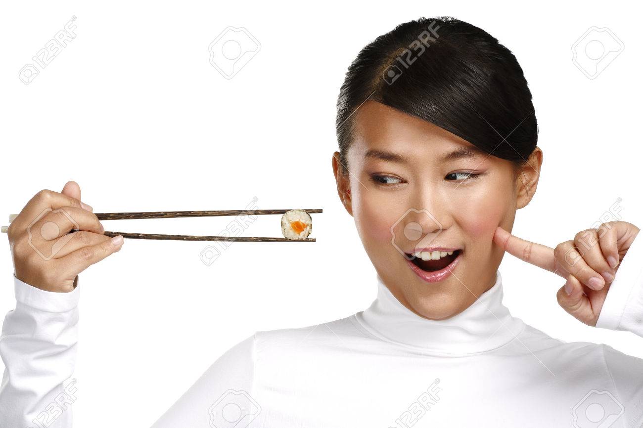 Chinese woman showing asian food using chopstick on white - 24479760 Chinese woman showing asian food using chopstick on white - 24479760