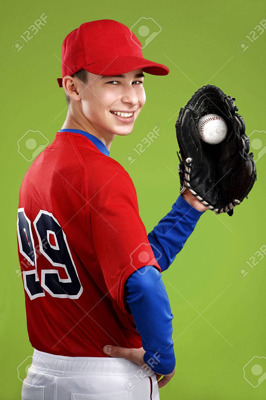 portrait of a beautiful teen baseball player in red and white uniform on colorful background - 26906546 portrait of a beautiful teen baseball player in red and white uniform on colorful background - 26906546