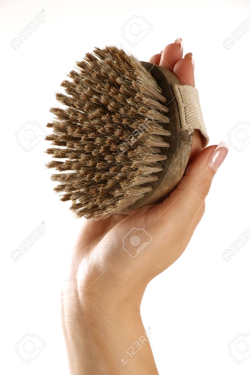 scrub brush in a beautiful female hand on white - 29109099 scrub brush in a beautiful female hand on white - 29109099