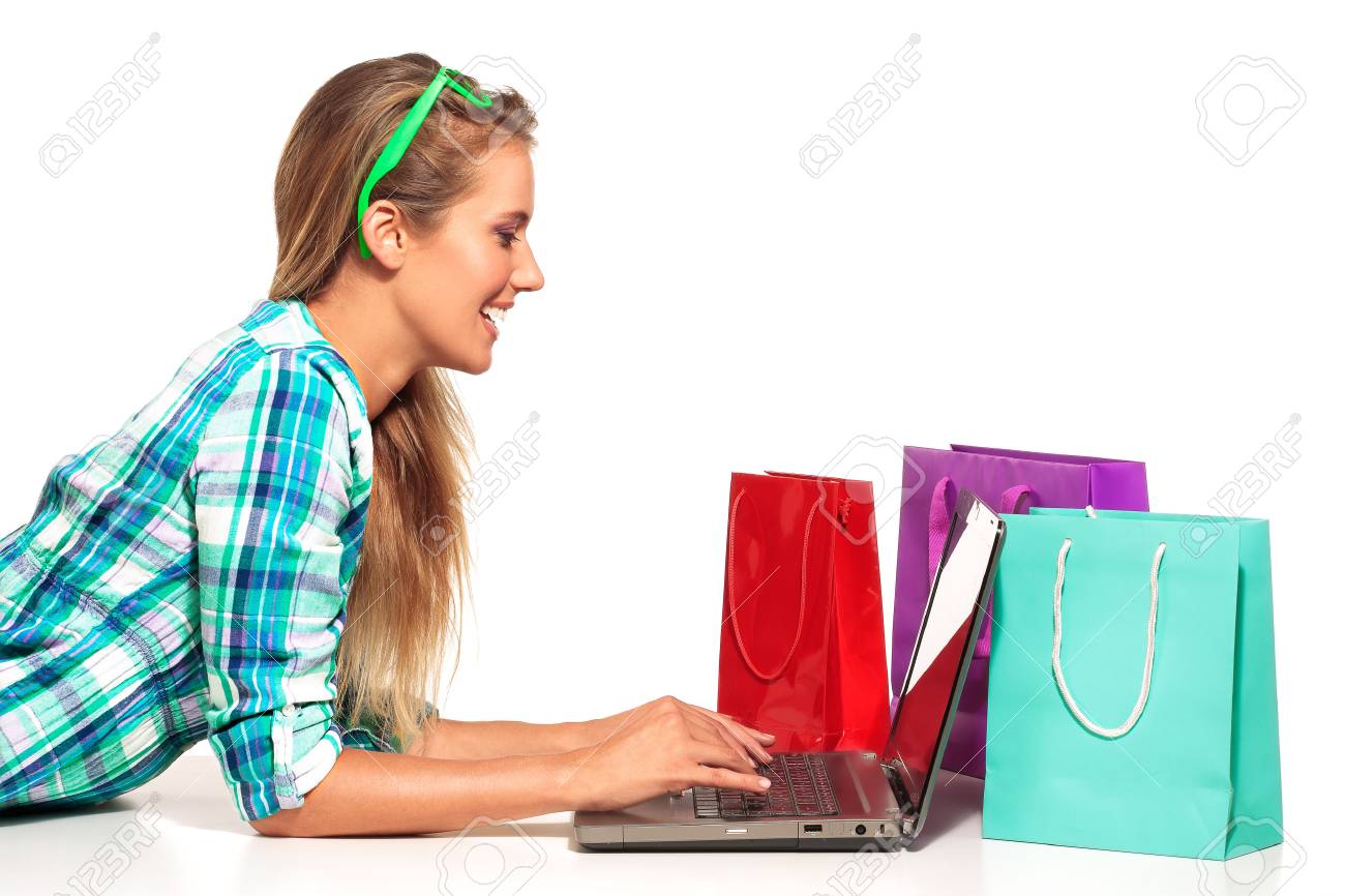 Young Woman Sitting at the desk shopping Online on white - 30316824 Young Woman Sitting at the desk shopping Online on white - 30316824