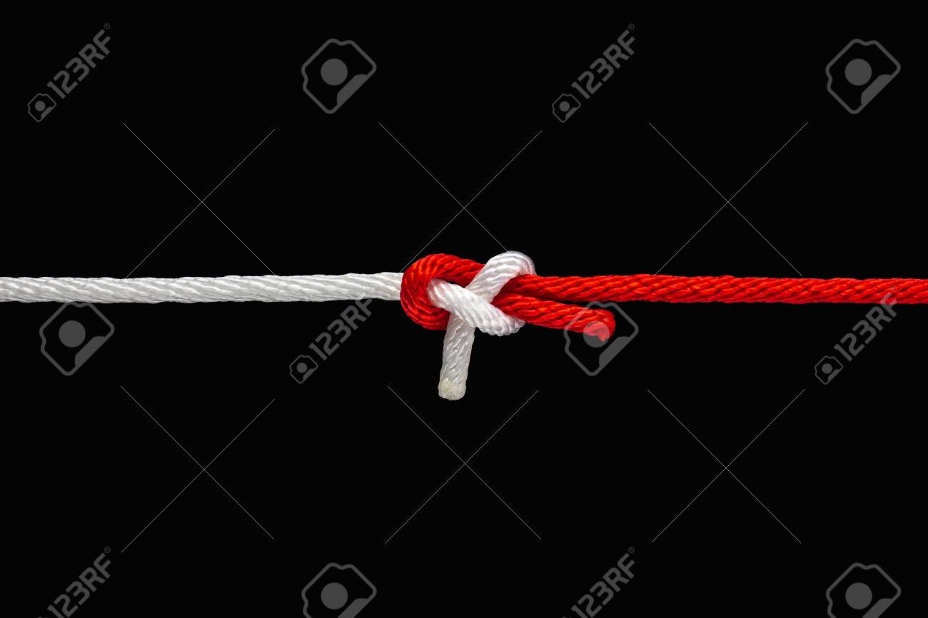 Tie the knot with red and white rope on black background with clipping path - 136726029 Tie the knot with red and white rope on black background with clipping path - 136726029