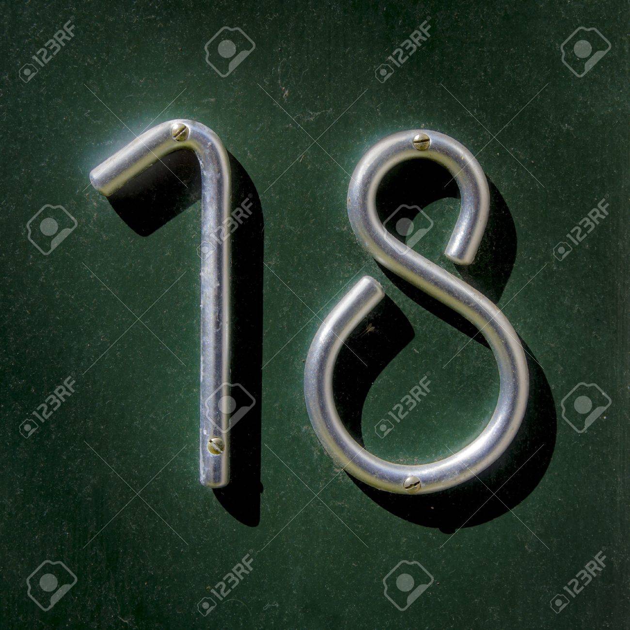 House Number Eightteen Made Out Of A Bent Aluminum Bar Stock Photo, Picture  and Royalty Free Image. Image 13767099.