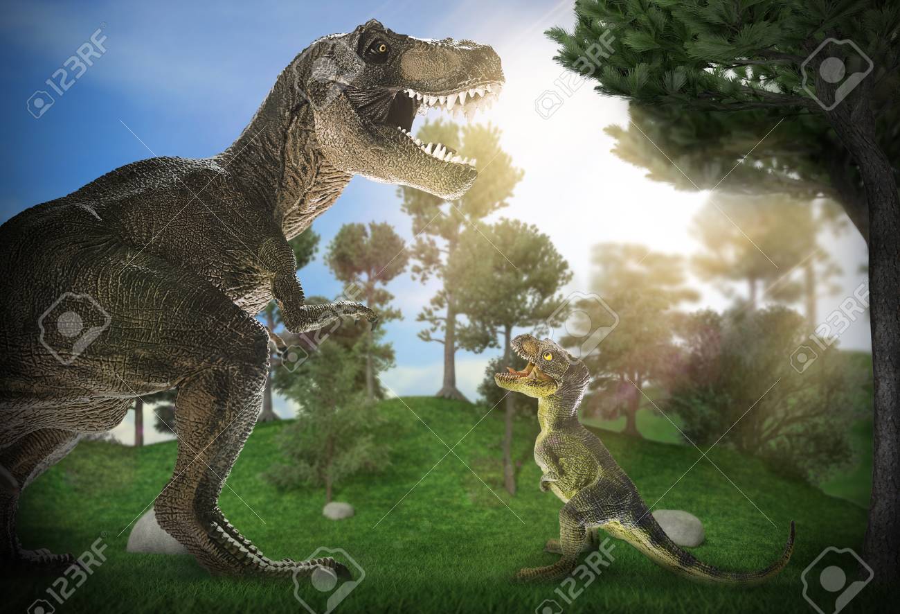 dinosaur scene of the two dinosaurs fighting each stock photo