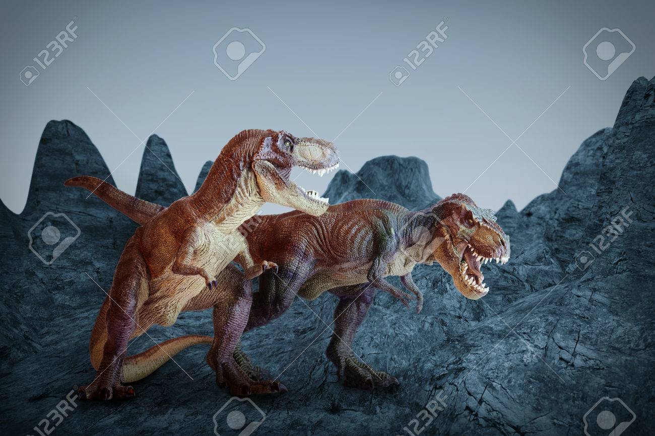 dinosaur scene of the two dinosaurs fighting each stock photo