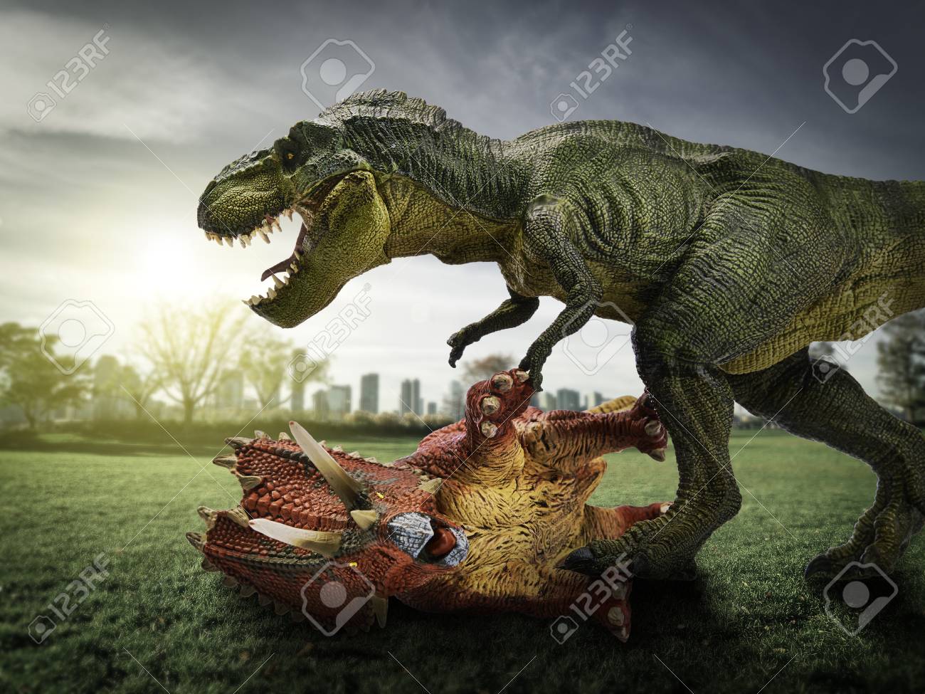 dinosaur scene of the two dinosaurs fighting each stock photo