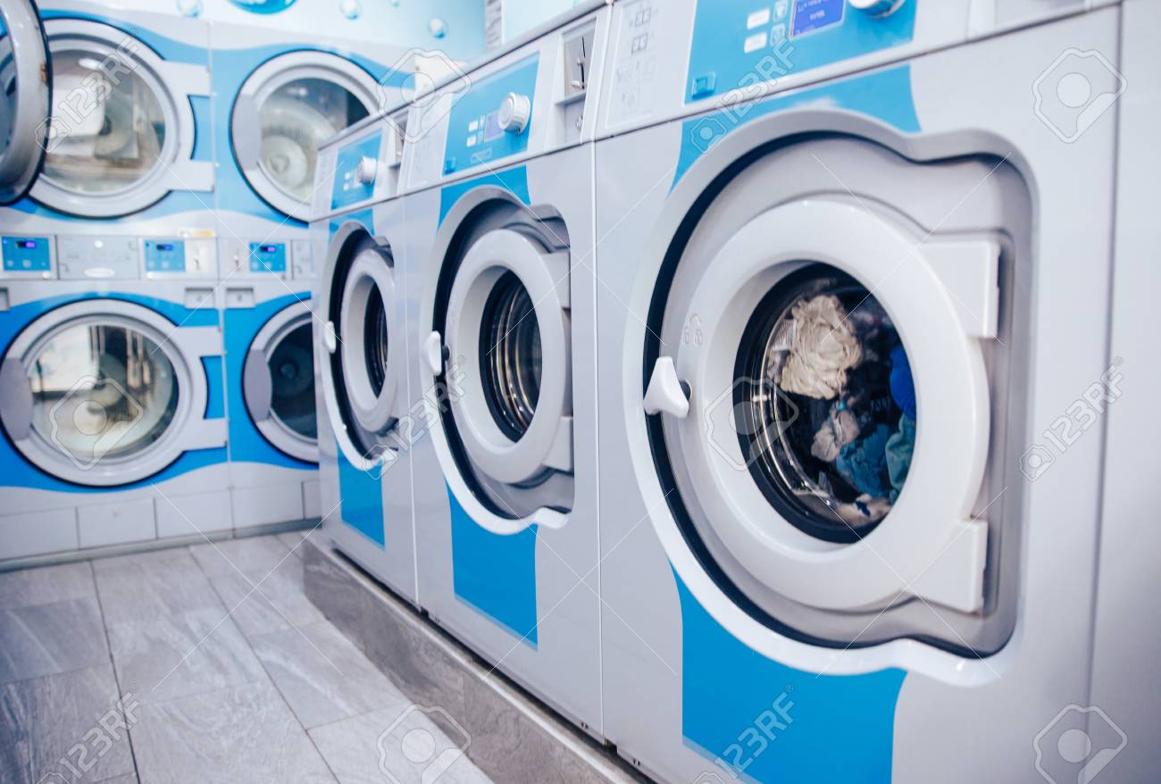 Row Of Industrial Laundry Machines In Commercial Laundromat... Stock Photo, Picture And Royalty Free Image. Image 121363578.