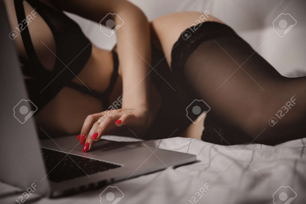 Young Beautiful Woman In Black Underwear Watches Adult Erotica Video And  Caresses Herself. Concept Webcam Internet Virtual Sex Model Stock Photo,  Picture and Royalty Free Image. Image 163947053.