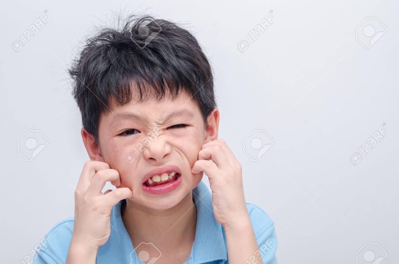 Young asian boy scratching his allergy face - 62811451 Young asian boy scratching his allergy face - 62811451