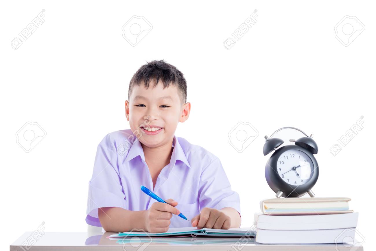 young asian schoolboy doing homework over white - 83225674 young asian schoolboy doing homework over white - 83225674