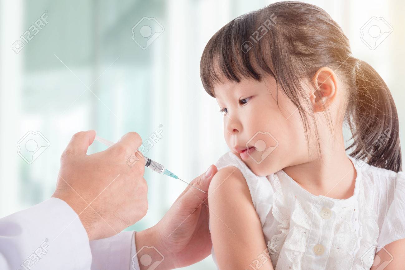 Little asian girl receiving vaccine at hospital - 85699175 Little asian girl receiving vaccine at hospital - 85699175