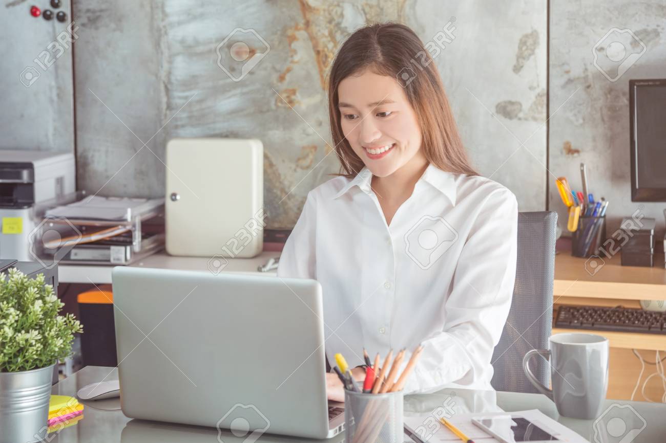 Beautiful asian woman working in office - 87860055 Beautiful asian woman working in office - 87860055