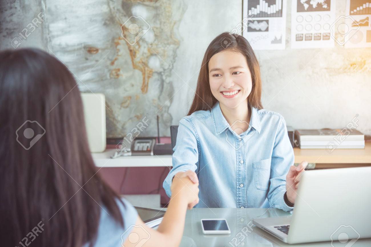 Beautiful asian woman shaking hand with partner in office - 87704291 Beautiful asian woman shaking hand with partner in office - 87704291