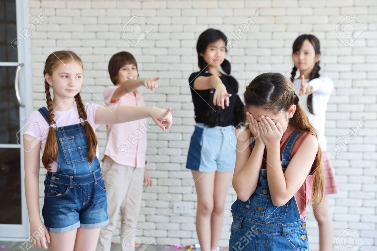 Group Of School Kids Pointing To Cute Girl Which Crying In Class Stock  Photo, Picture And Royalty Free Image. Image 154508045.
