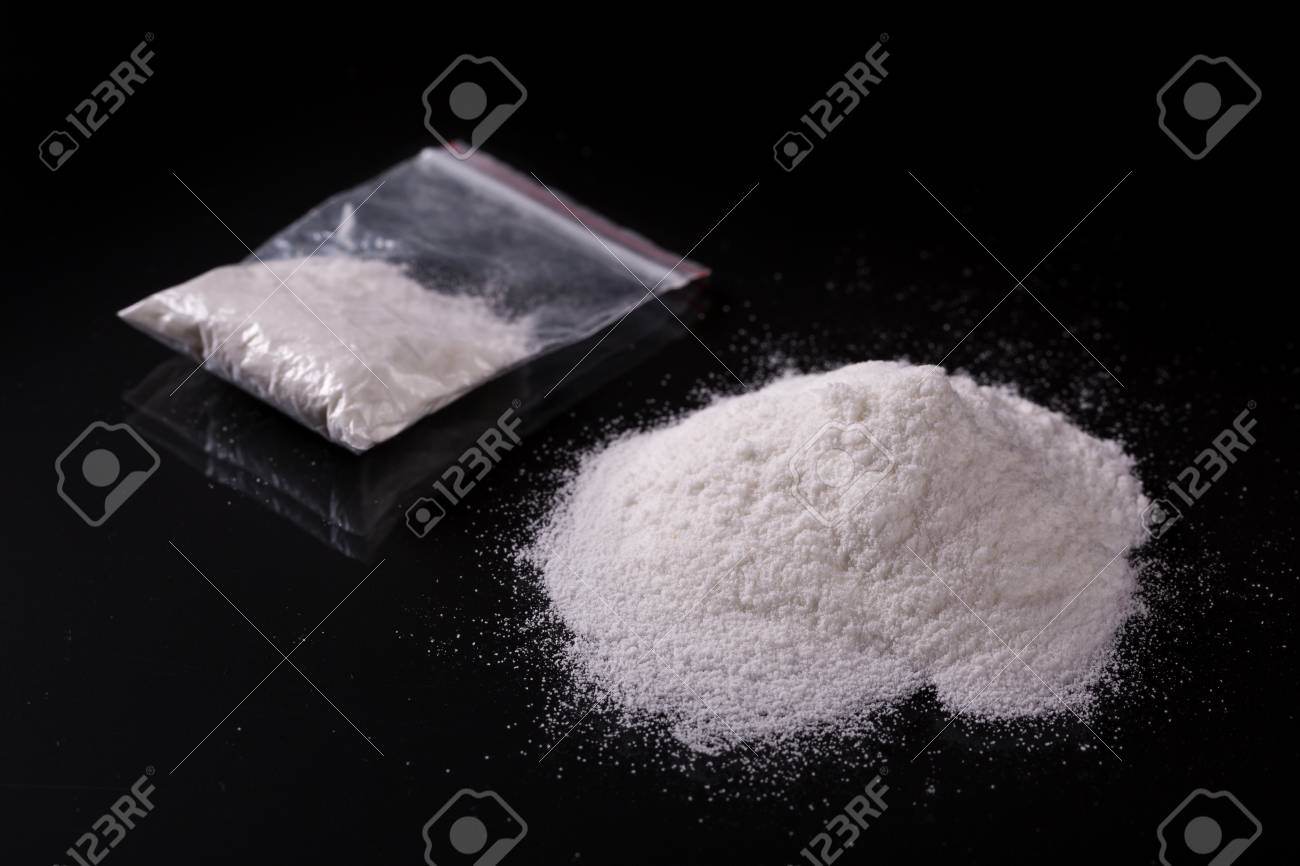 Cocaine in plastic packet on black background, closeup - 90964208 Cocaine in plastic packet on black background, closeup - 90964208
