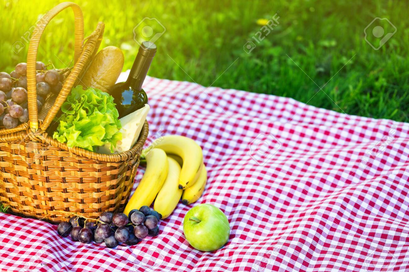 Wicker Picnic Basket With Cheese And Wine On Red Checkered Table Stock Photo Picture And Royalty Free Image Image 121784732