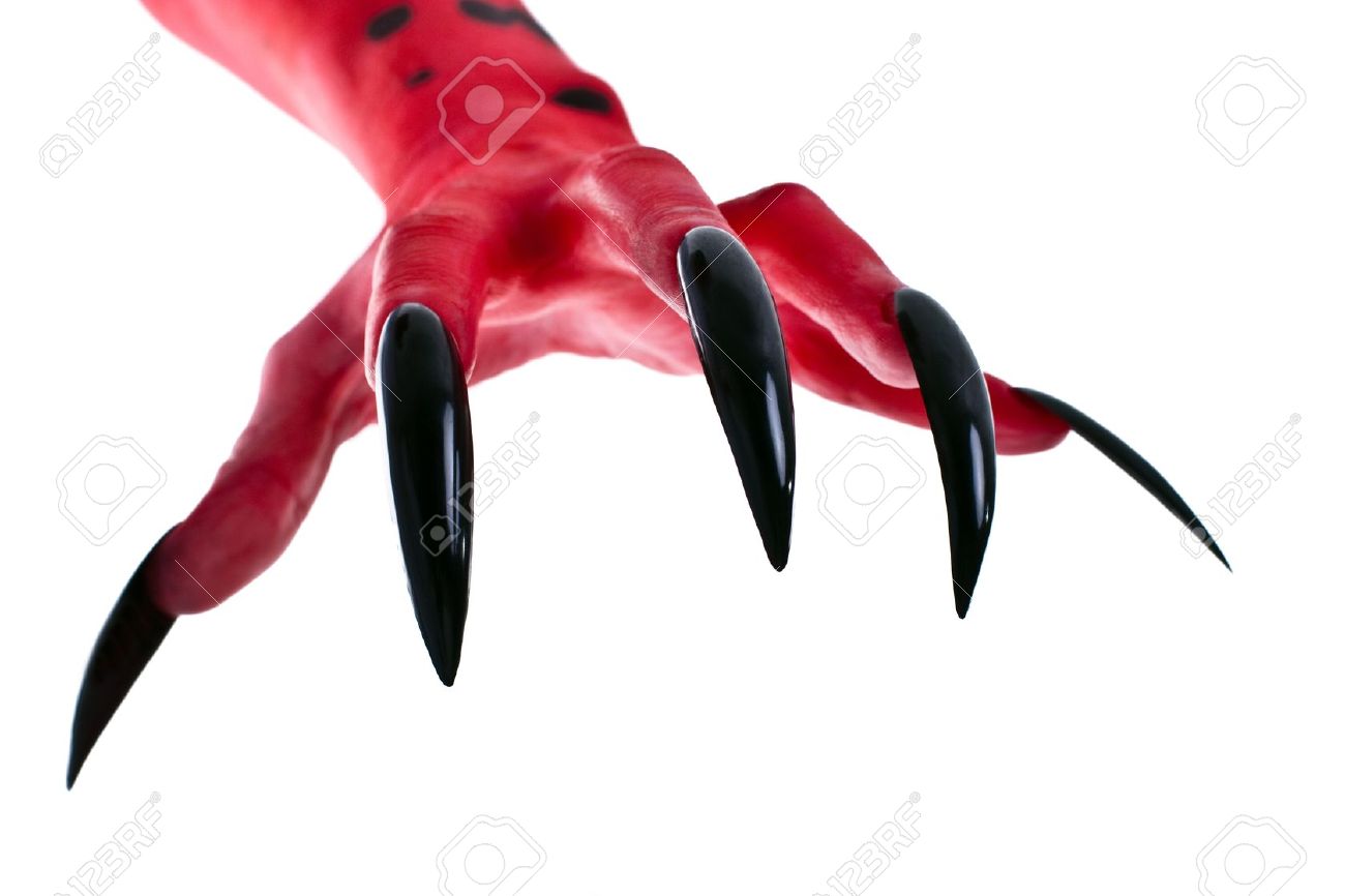 Red devil hands with black nails, real body-art Stock Photo - Alamy