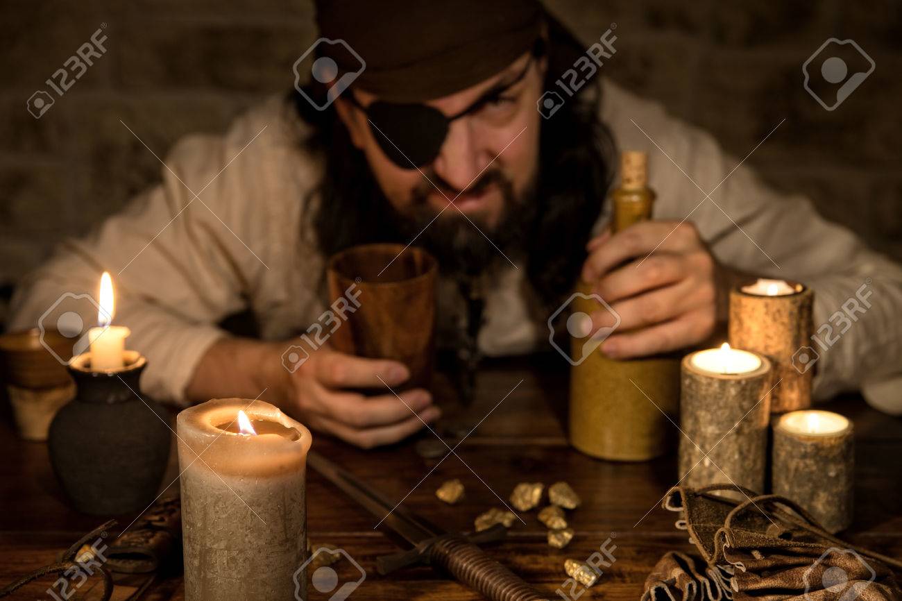 Grumpy Pirate With A Bottle Of Rum Sitting On A Medieval Table With A Lot Of Candles Stock Photo Picture And Royalty Free Image Image Grumpy Pirate With A Bottle Of Rum Sitting On A Medieval Table With A Lot Of Candles Stock Photo Picture And Royalty Free Image Image