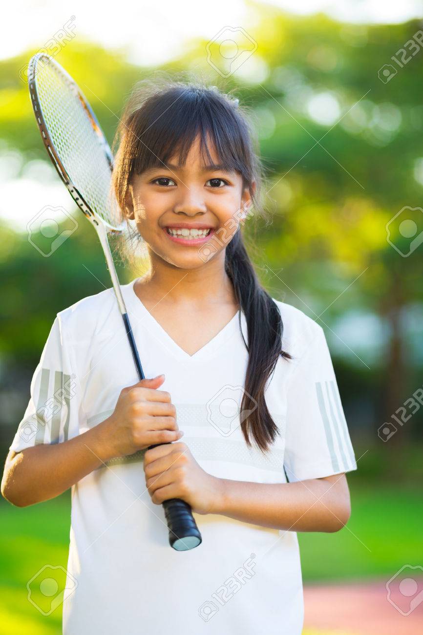 Closeup Cute Little Asian Girl Holding A Badminton Racket Stock Photo 42863611 Closeup Cute Little Asian Girl Holding A Badminton Racket Stock Photo 42863611