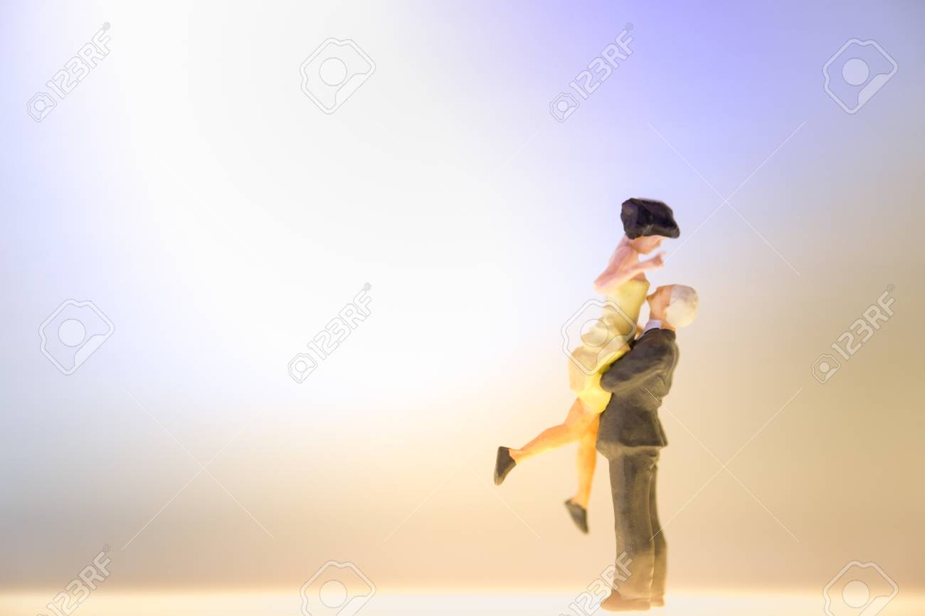 Miniature Couple Dancing Or Standing On The Shining Floor Love