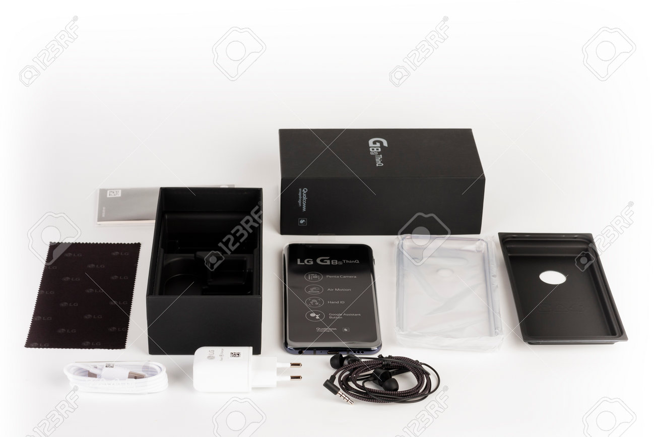 Brnenec, Czech Republic - January 20, 2020: Unboxing of touchscreen smartphone LG G8S ThinQ, .silicone cover, charger, earphones, clean cloth. LG is a South Korean multinational electronics company. - 162225014 Brnenec, Czech Republic - January 20, 2020: Unboxing of touchscreen smartphone LG G8S ThinQ, .silicone cover, charger, earphones, clean cloth. LG is a South Korean multinational electronics company. - 162225014