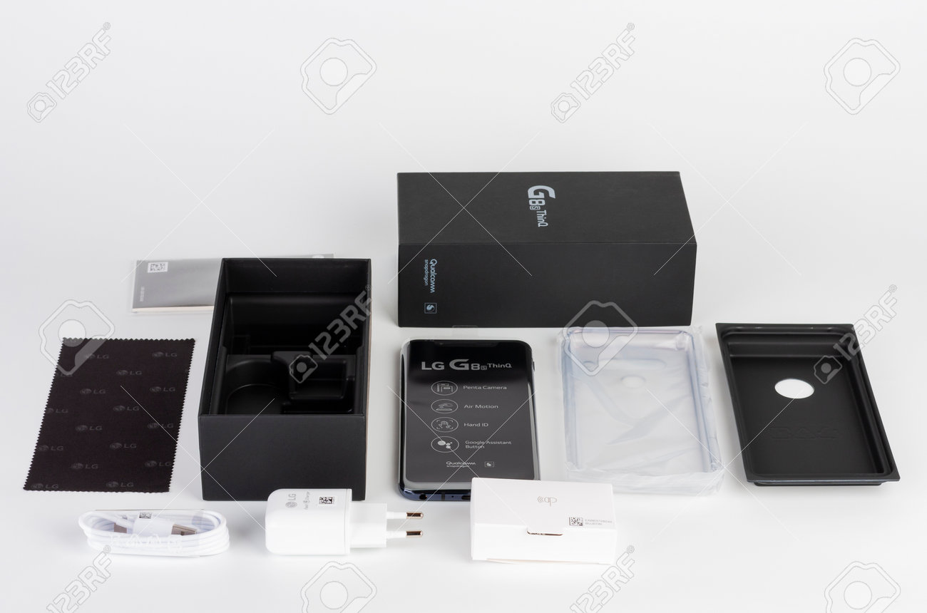 Brnenec, Czech Republic - January 20, 2020: Unboxing of touchscreen smartphone LG G8S ThinQ, silicone cover, charger, earphones, clean cloth. LG is a South Korean multinational electronics company. - 162225017 Brnenec, Czech Republic - January 20, 2020: Unboxing of touchscreen smartphone LG G8S ThinQ, silicone cover, charger, earphones, clean cloth. LG is a South Korean multinational electronics company. - 162225017