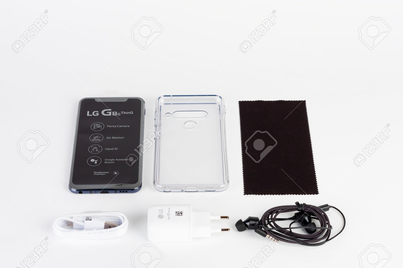 Brnenec, Czech Republic - January 20, 2020: Unboxing of touchscreen smartphone LG G8S ThinQ, .silicone cover, charger, earphones, clean cloth. LG is a South Korean multinational electronics company. - 162225021 Brnenec, Czech Republic - January 20, 2020: Unboxing of touchscreen smartphone LG G8S ThinQ, .silicone cover, charger, earphones, clean cloth. LG is a South Korean multinational electronics company. - 162225021
