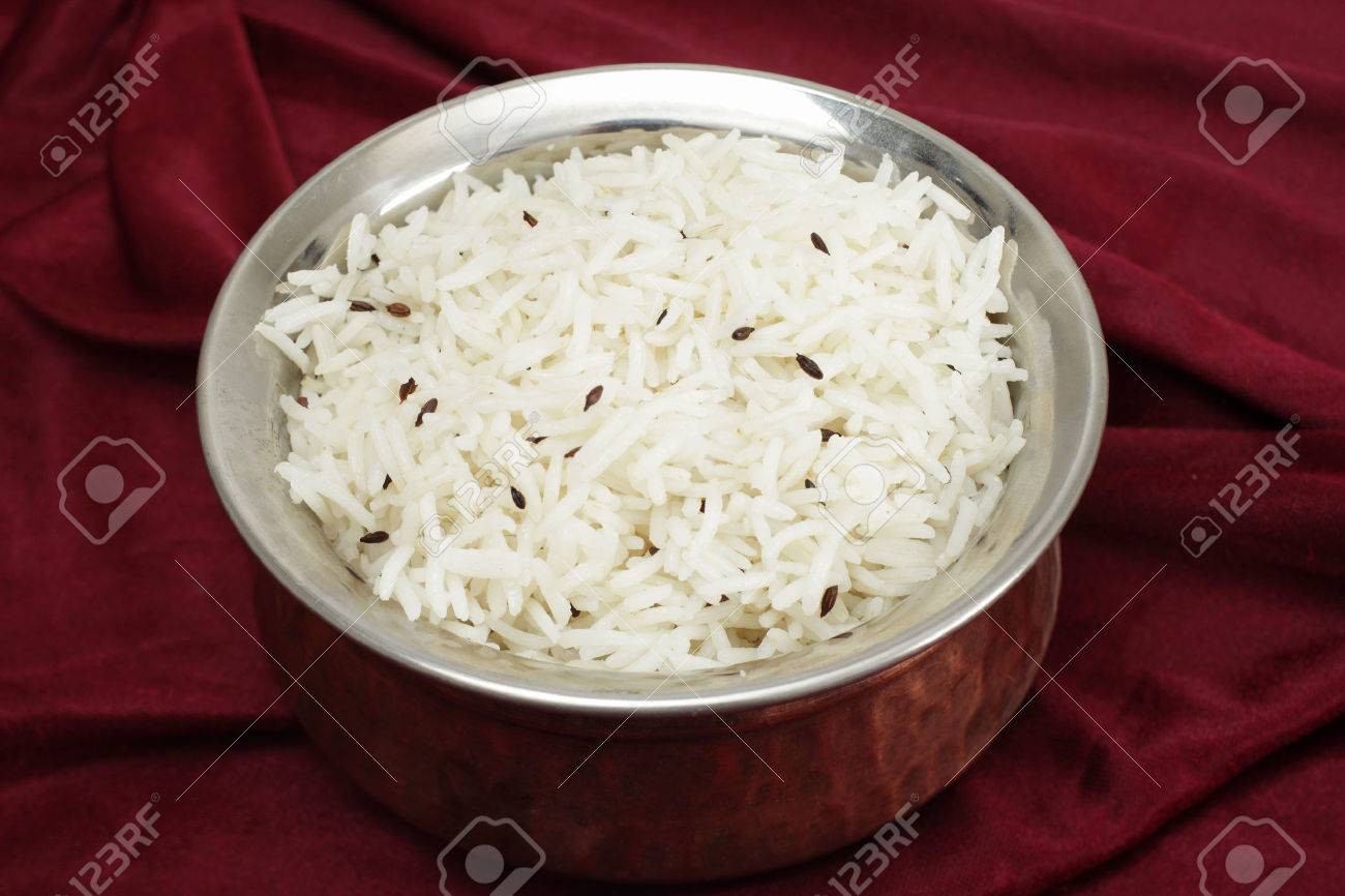 Jeera rice - long-grain basmati rice flavoured with fried cumin seeds - in a beaten copper and steel serving bowl - 22979353 Jeera rice - long-grain basmati rice flavoured with fried cumin seeds - in a beaten copper and steel serving bowl - 22979353