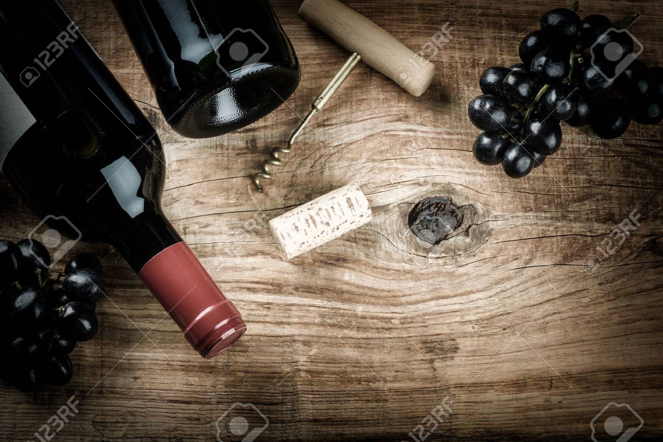 Setting with bottle of red wine, grape and corks. Wine list concept with copy space - 51415208 Setting with bottle of red wine, grape and corks. Wine list concept with copy space - 51415208