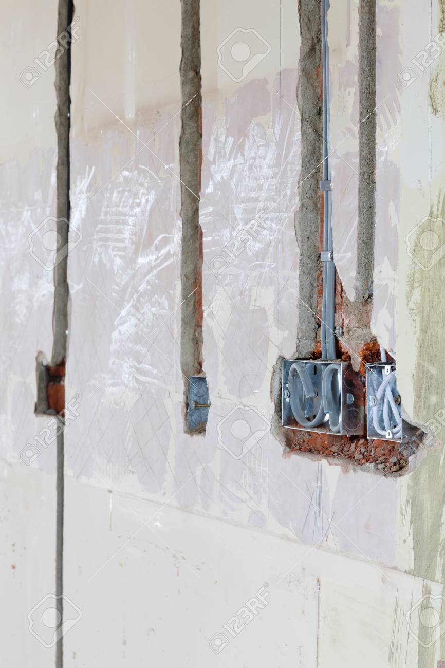 Stock Photo - UK Electrical wiring first fix in a wall of a house