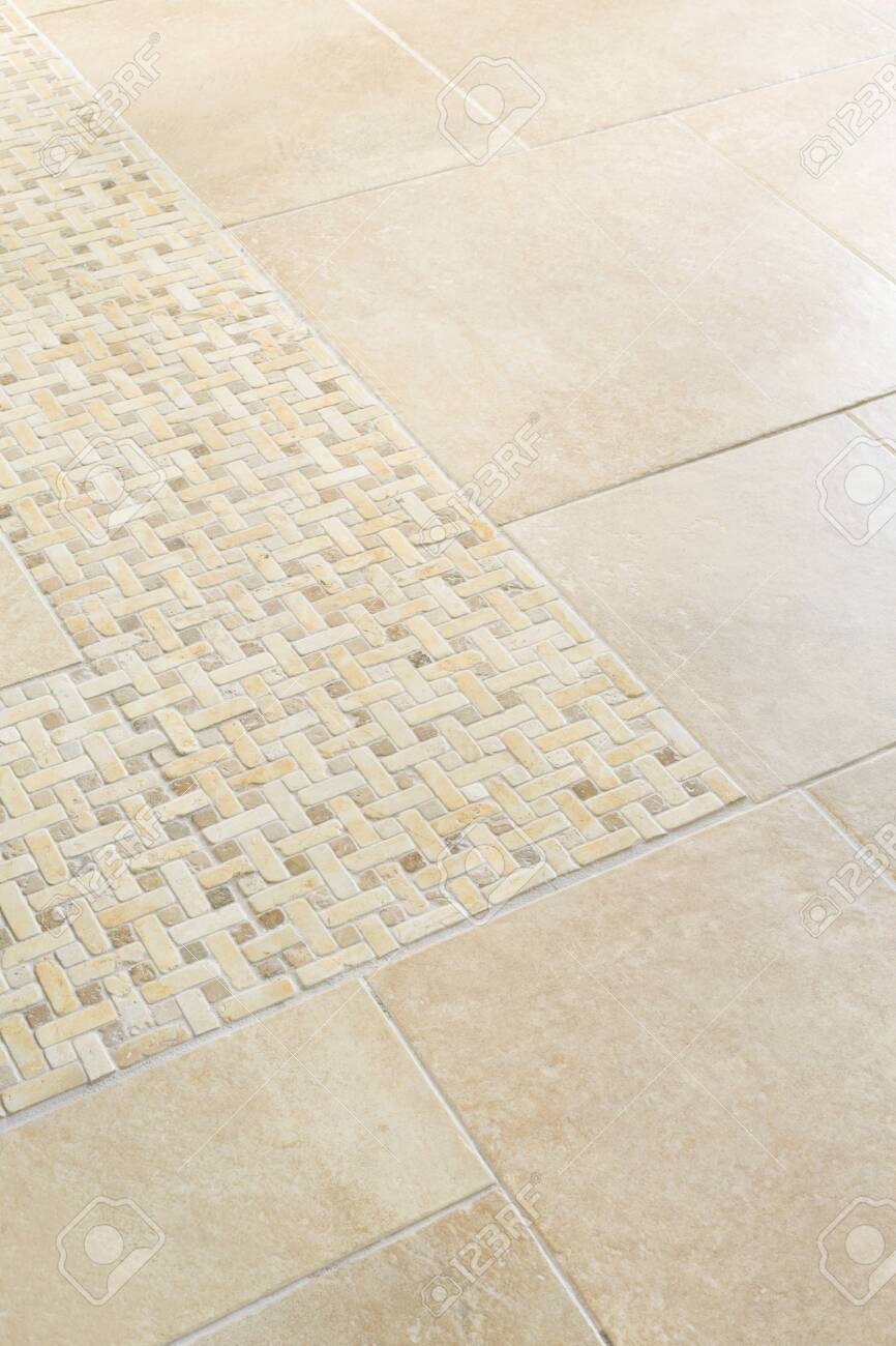 Porcelain Floor Tiles With A Stone Mosaic Design In A Neutral