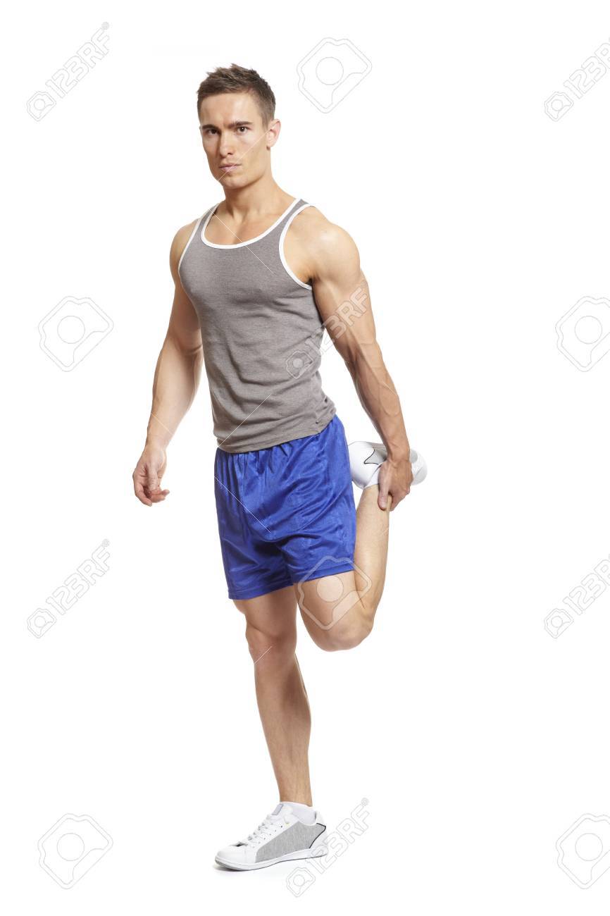 スポーツ服に足を伸ばす筋肉の若い男 の写真素材 画像素材 Image