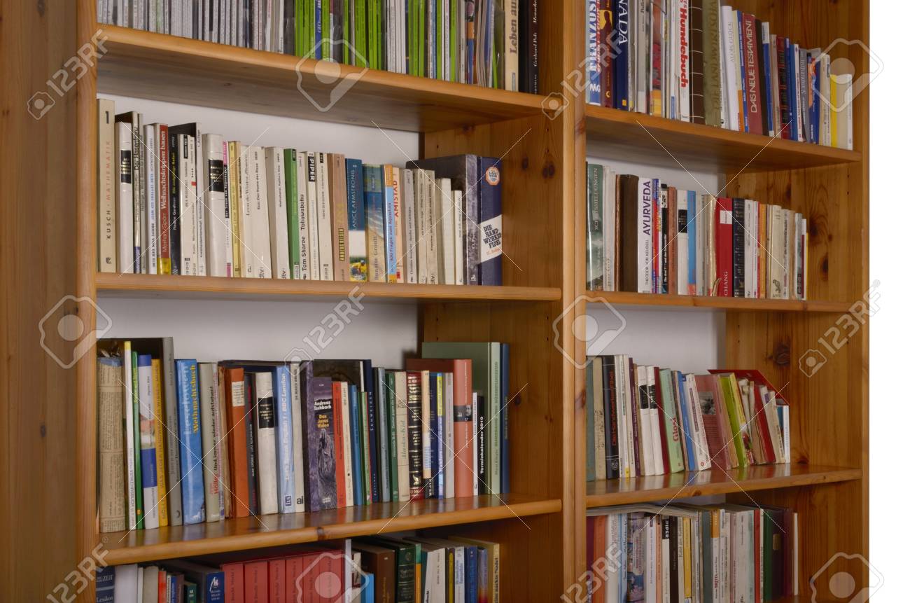 bookshelf with books and magazines german titles stock photo