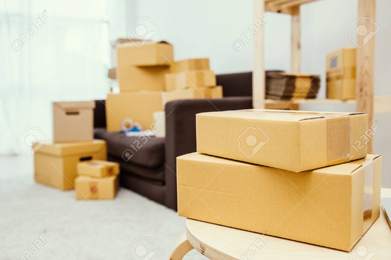 arrangement of empty cardboard packing boxes standing on a floor