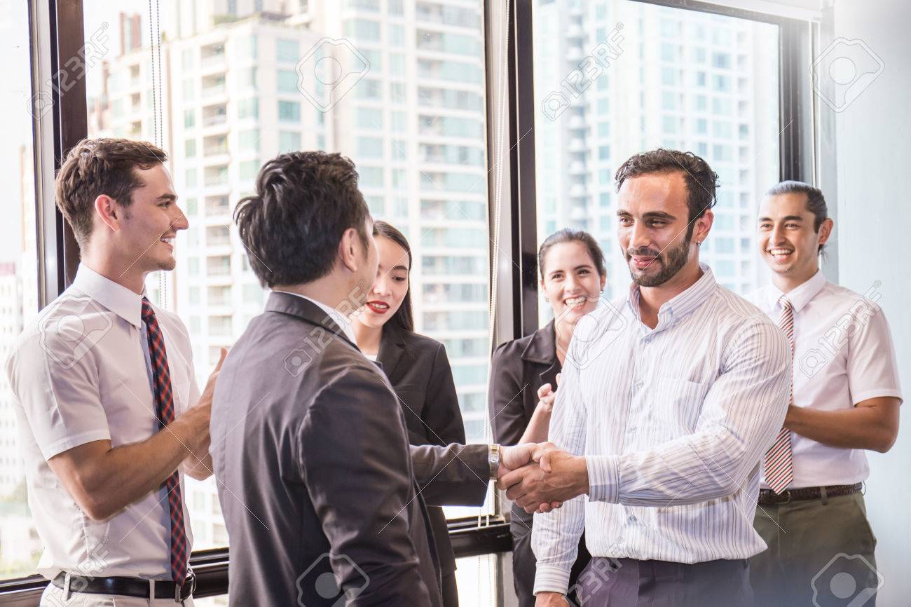 group of multicultural employees talking and having fun in the