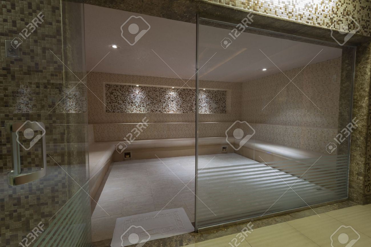 Large Steam Room With Glass Door In Health Spa At A Luxury Hotel Large Steam Room With Glass Door In Health Spa At A Luxury Hotel Stock Photo