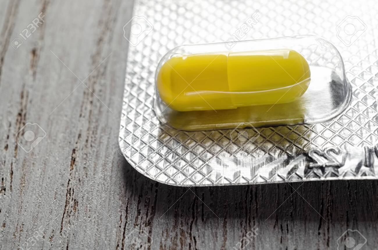 Download Yellow Drug Pill In Foil Package Closeup Stock Photo Picture And Royalty Free Image Image 132913244 Yellowimages Mockups