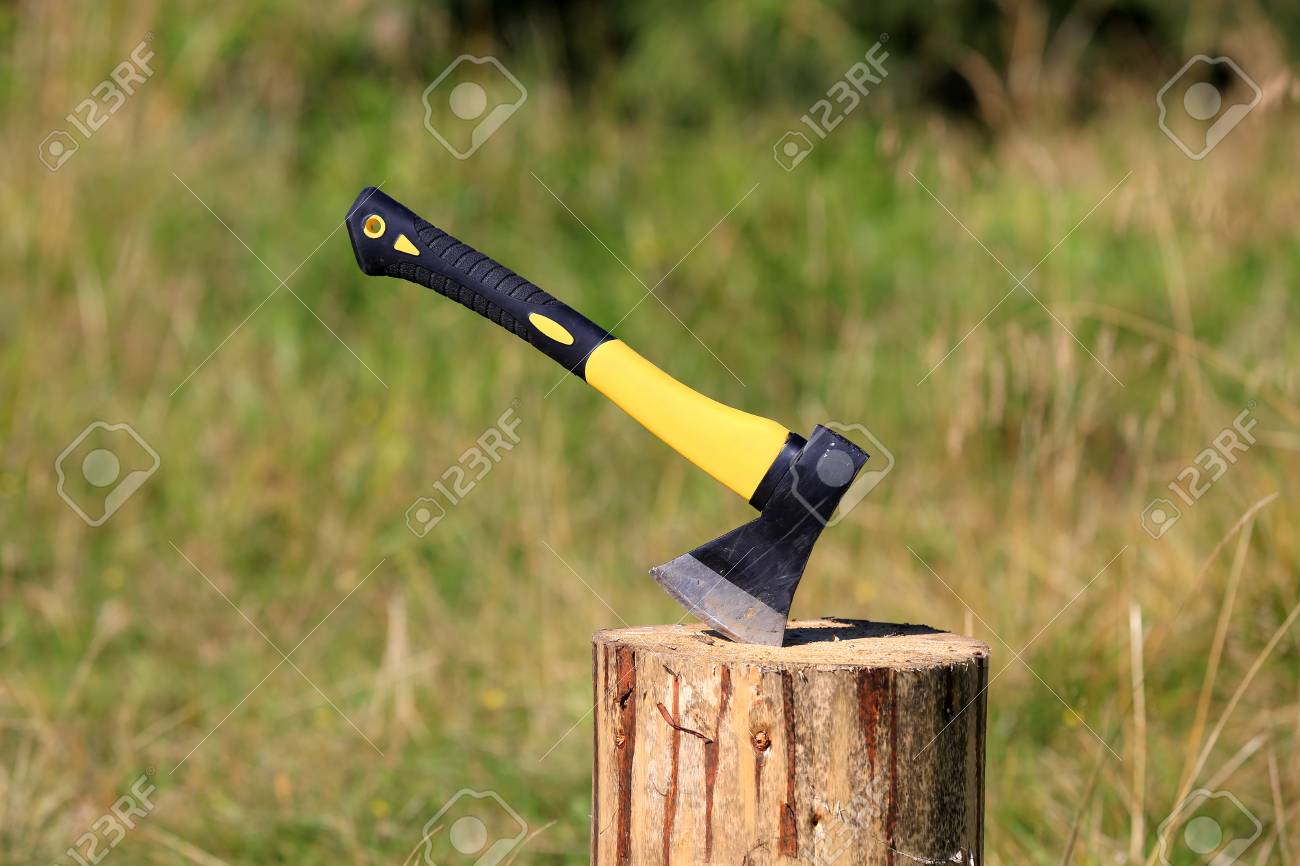 Abstract Modern Axe In Wooden Log Stock Photo Picture And Royalty Free Image Image