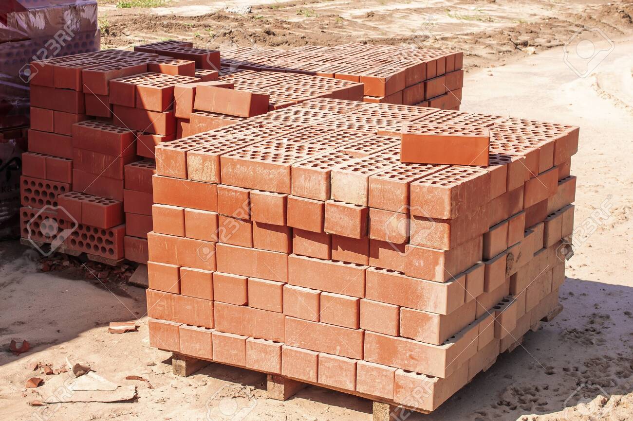 The Red Bricks Are Stacked On Wooden Pallets And Prepared For Stock Photo Picture And Royalty Free Image Image