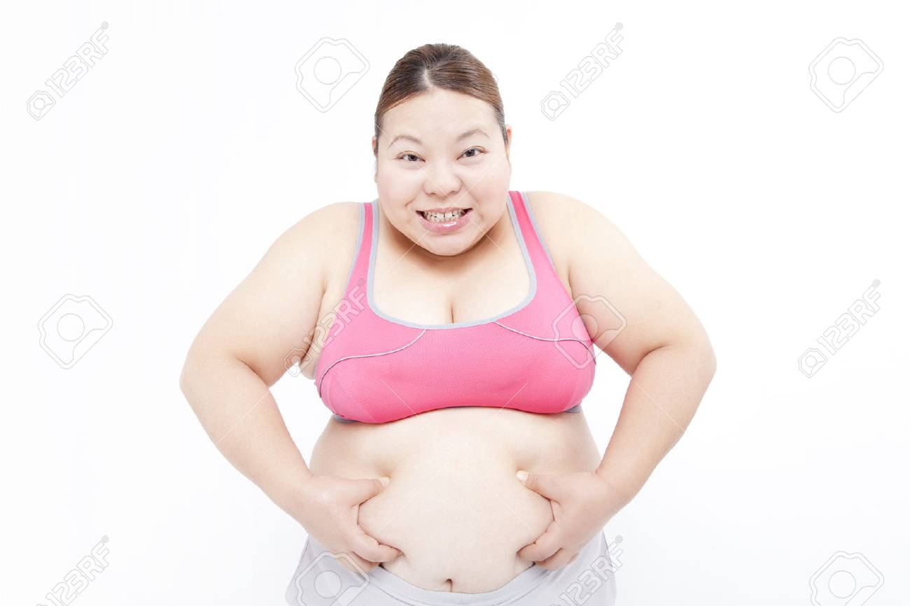 メタボ女性が腹をつかむ の写真素材 画像素材 Image