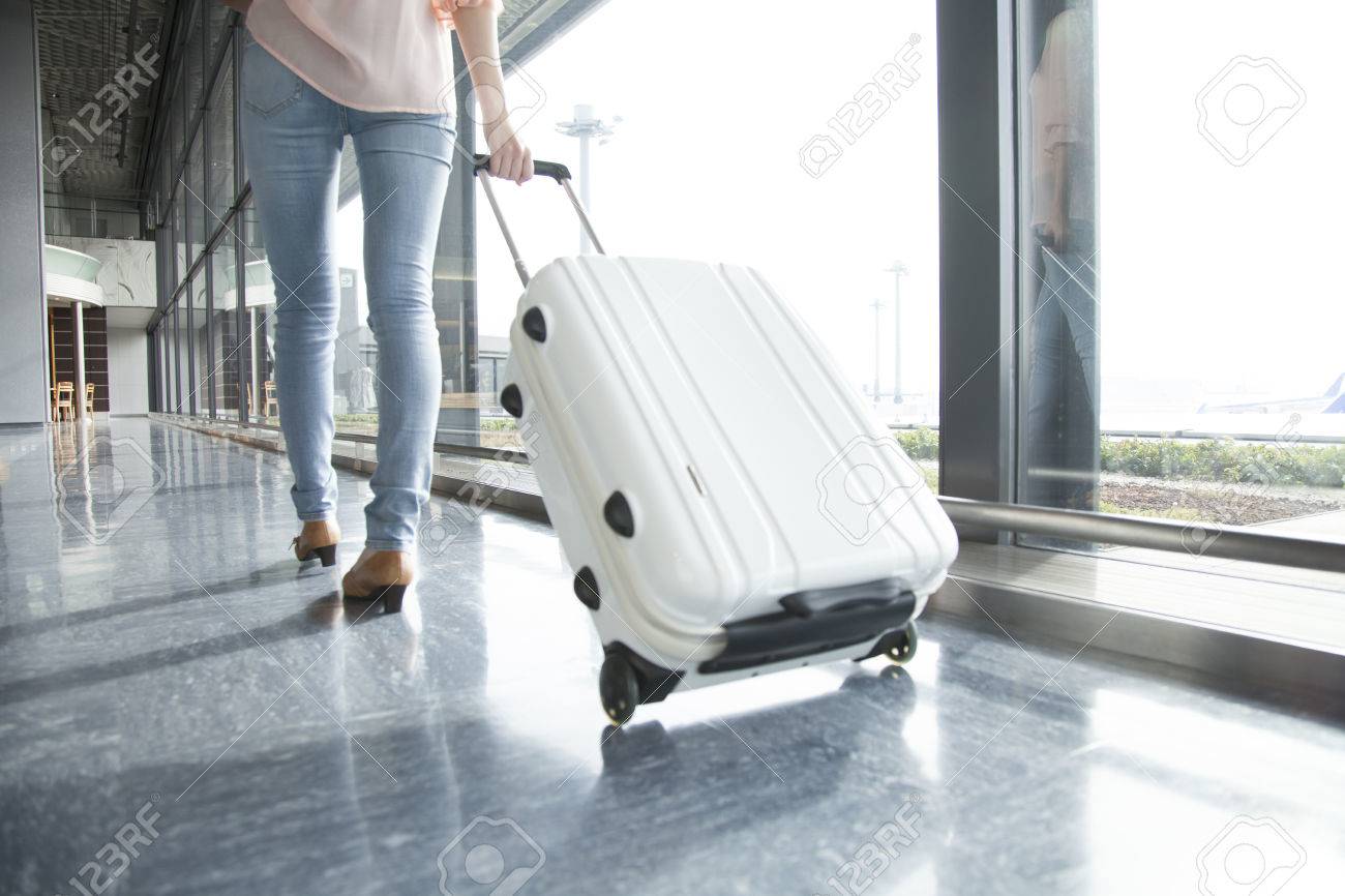 From behind the woman walking by subtracting the suitcase - 51459292 From behind the woman walking by subtracting the suitcase - 51459292