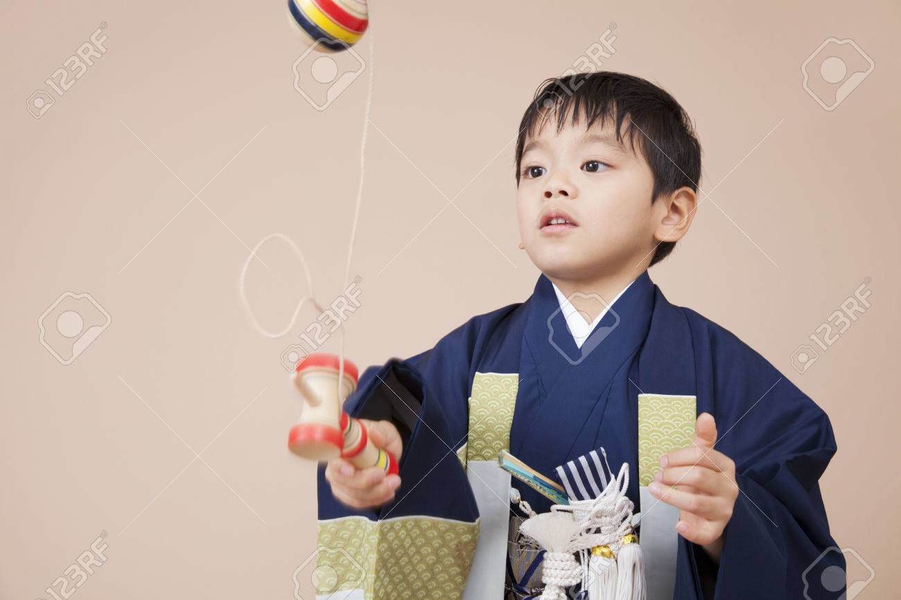 Boys playing in kendama - 51460659 Boys playing in kendama - 51460659